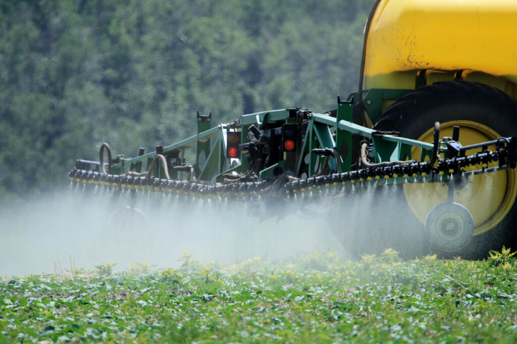 Spraying fertilizer on canola crop